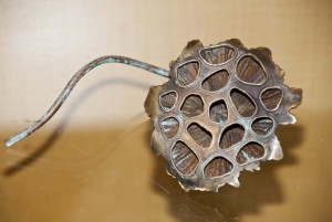 Metalworks by the students of MassArt, are on display in the first floor cases at Brookline Main Library